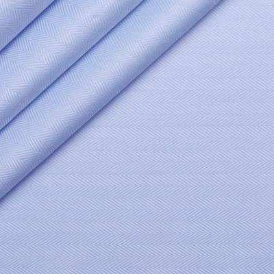 Sky blue herringbone 100% Giza Egyptian cotton fabric for a luxury custom fit dress shirt, featuring a refined woven pattern and premium smooth texture, ideal for personalized mens custom shirts and bespoke dress shirt designs.