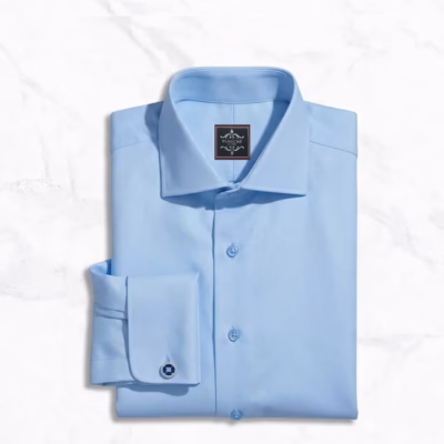 Pale blue mens dress shirt with modern wide spread collar, French round cuffs, custom Giza cotton twill fabric, and clean pocketless design